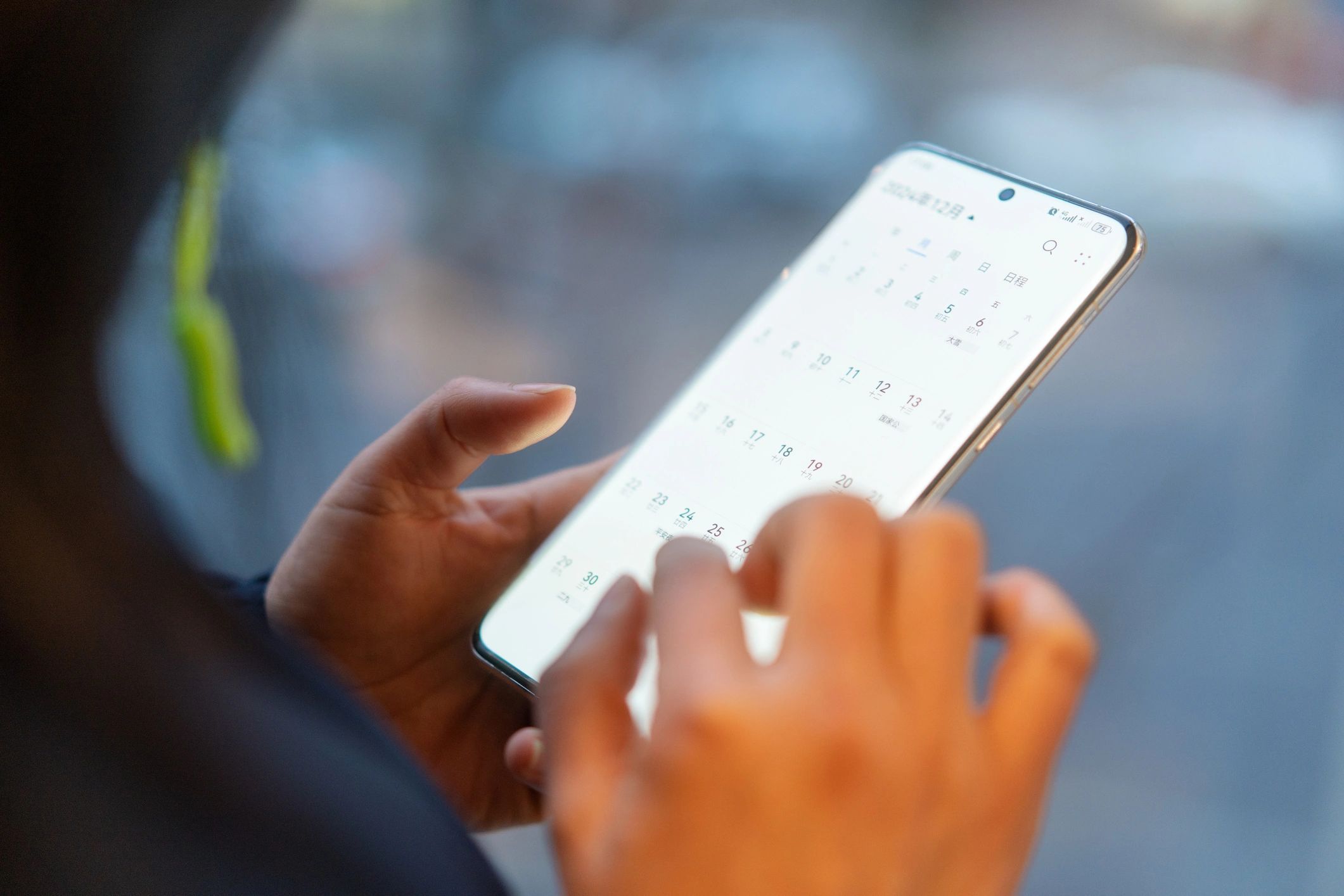Person checking a calendar on a mobile phone